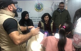 ضمن حملة منظمة حمورابي في مساعدة الفقراء والايتام لمناسبة اعياد الميلاد ورأس السنة